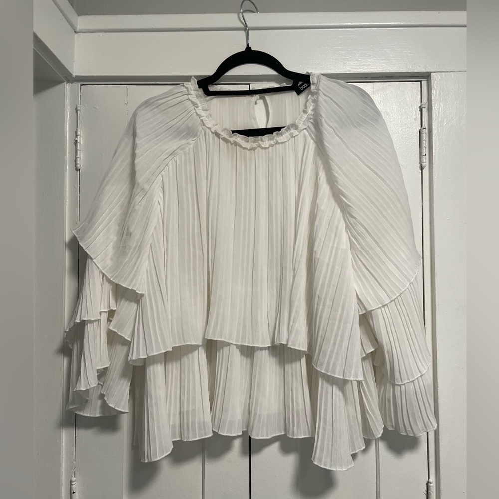 White ruffle blouse